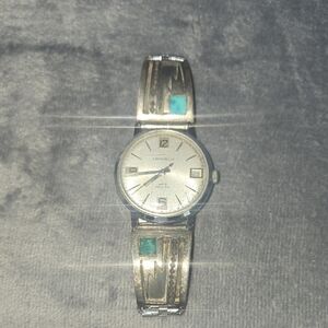Elegant Silver Smartwatch with Turquoise Highlights